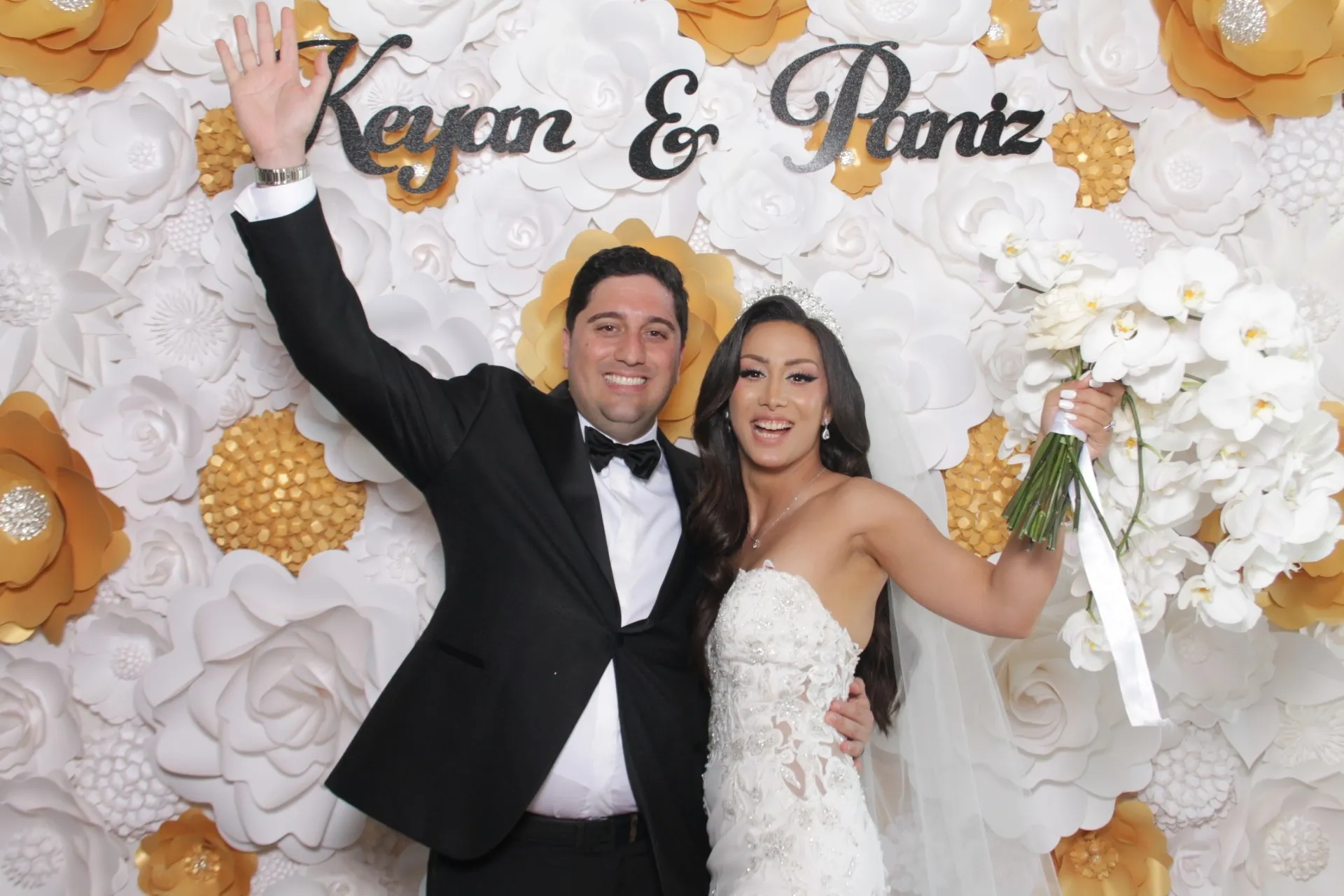 Couple portrait in a luxury glam booth with black-and-white editorial finish.