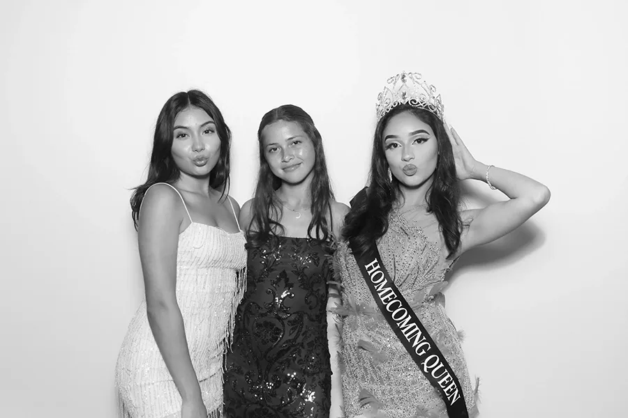 Birthday celebration portrait captured with clean glam booth lighting.