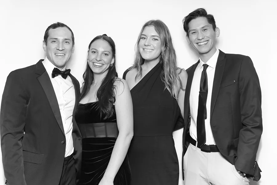 Group glam portrait with studio-style lighting and elevated presentation.